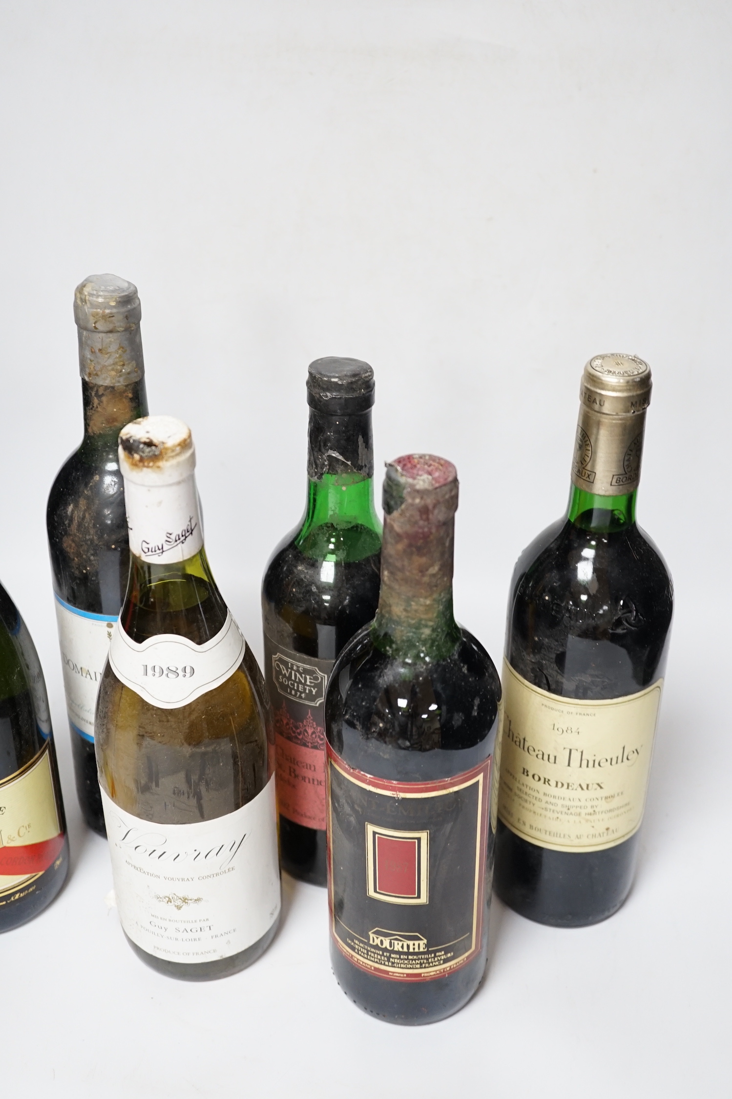 Five various bottles of wine to include Chateau La Tour St. Bonnet 1972, Vouvray 1989, Domaine La Grave 1984, Saint Emilion, Chateau Thieuley 1984 and a bottle of Mumm Champagne